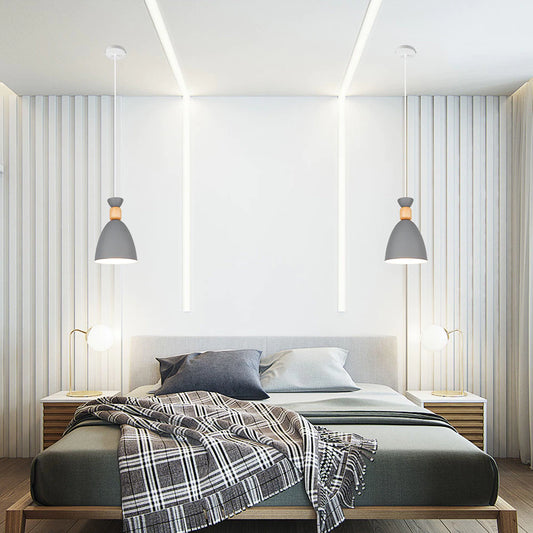 Grijze Scandinavische hanglamp boven het bed